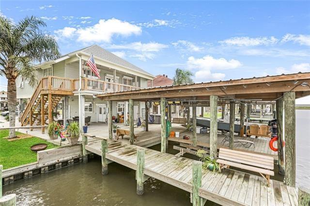 dock area featuring a deck with water view