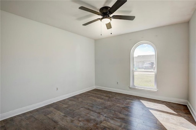 empty room featuring ceiling fan and dark hardwood / wood-style floors