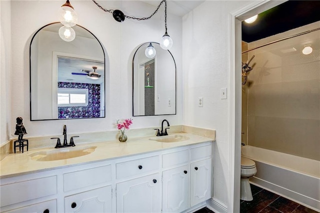 full bathroom with shower / bathing tub combination, vanity, and toilet