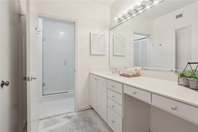 bathroom with walk in shower and vanity