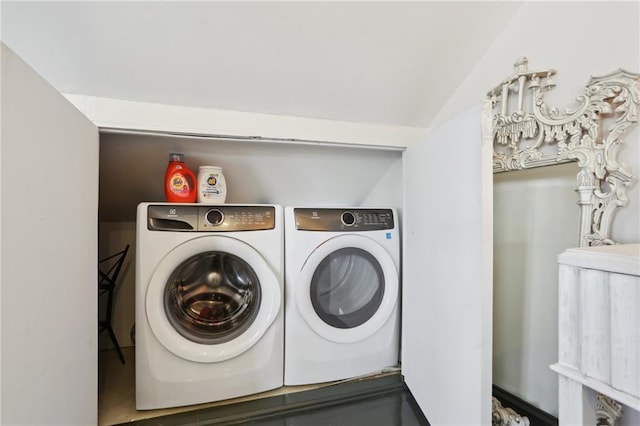 washroom featuring washer and clothes dryer