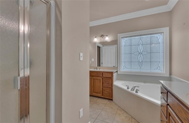 bathroom featuring independent shower and bath, tile patterned flooring, crown molding, and vanity