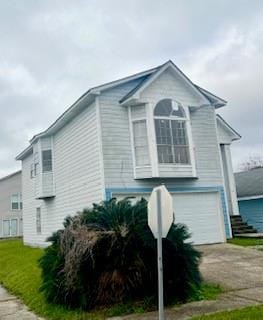 view of property exterior featuring a garage