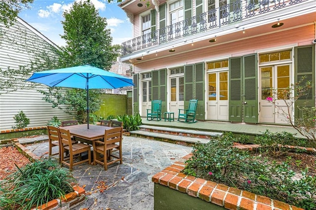 view of patio featuring a balcony