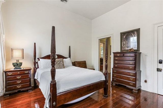 bedroom featuring dark wood-type flooring