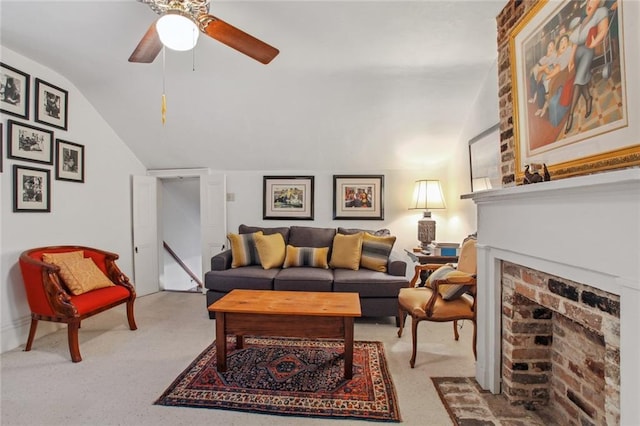 living room featuring a brick fireplace, ceiling fan, vaulted ceiling, and light carpet