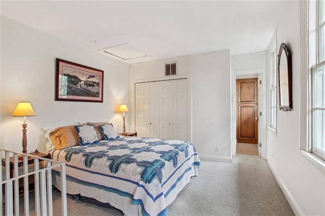 bedroom with carpet flooring and a closet