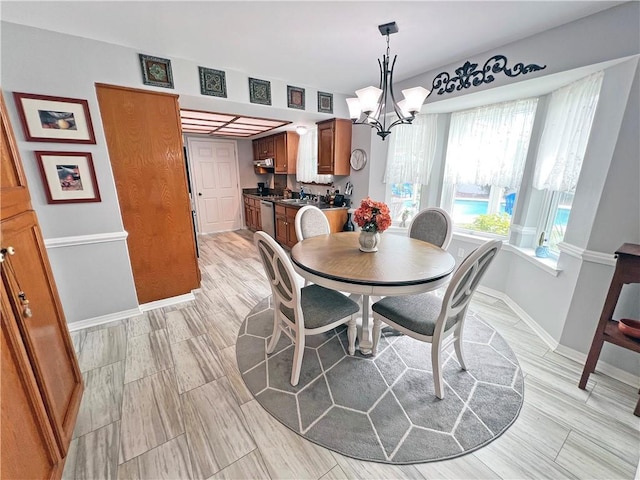 dining area featuring a notable chandelier