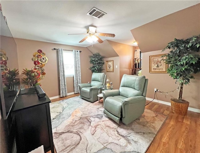 sitting room featuring lofted ceiling, ceiling fan, and wood-type flooring