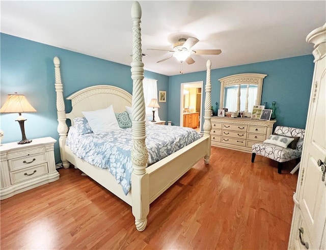 bedroom featuring ceiling fan, connected bathroom, and wood-type flooring