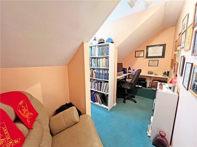 carpeted office with lofted ceiling