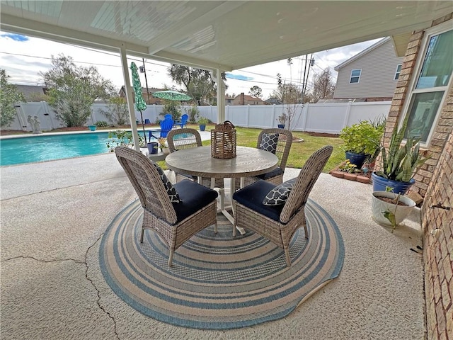 view of patio / terrace with a fenced in pool