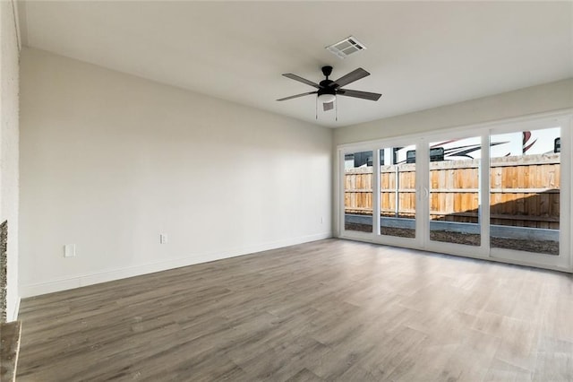 spare room with ceiling fan and hardwood / wood-style floors