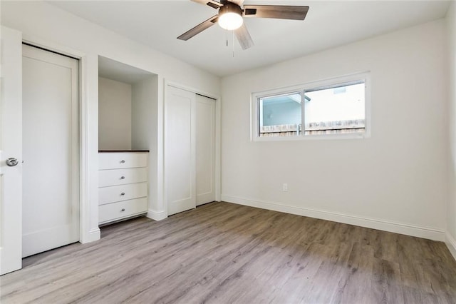 unfurnished bedroom featuring ceiling fan and light hardwood / wood-style flooring