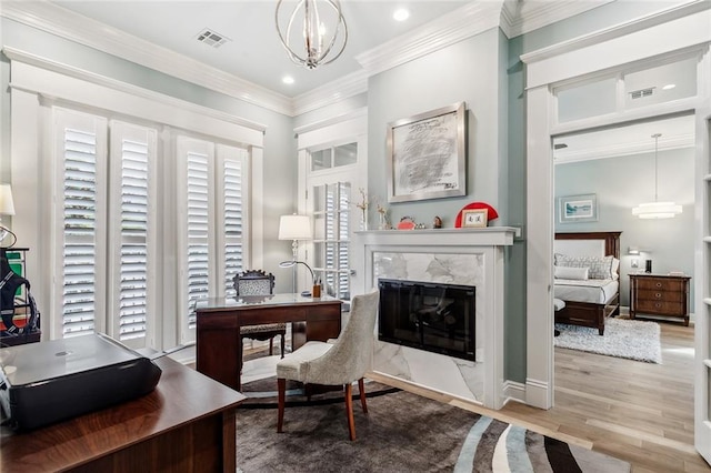 112 Bayou Perez Dr, Madisonville, LA 70447 - office space with wood finished floors, a fireplace, ornamental molding, a chandelier, and recessed lighting