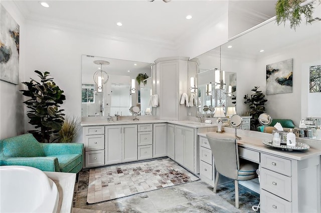 bathroom featuring ornamental molding, a bathtub, and vanity