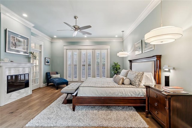 112 Bayou Perez Dr, Madisonville, LA 70447 - bedroom featuring wood finished floors, recessed lighting, and crown molding