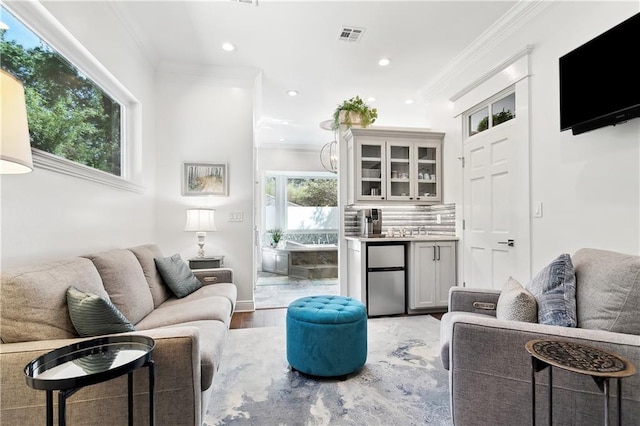 112 Bayou Perez Dr, Madisonville, LA 70447 - living room featuring light wood-style flooring, recessed lighting, and ornamental molding