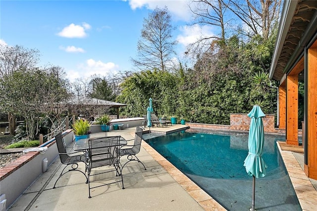 112 Bayou Perez Dr, Madisonville, LA 70447 - swimming pool featuring a patio area and outdoor dining space