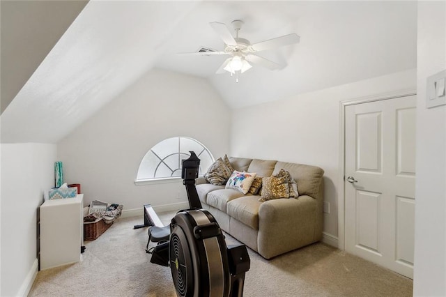 living room featuring vaulted ceiling, light colored carpet, and ceiling fan