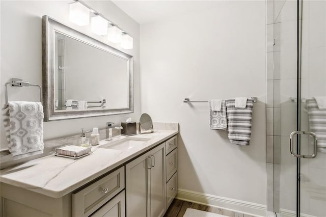 112 Bayou Perez Dr, Madisonville, LA 70447 - bathroom featuring vanity, a shower stall, wood finished floors, and baseboards