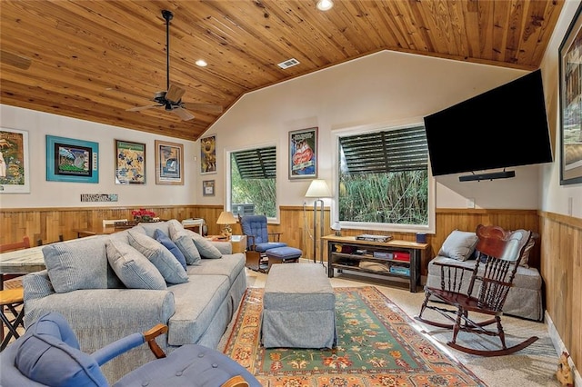 112 Bayou Perez Dr, Madisonville, LA 70447 - living room featuring a wainscoted wall, wooden ceiling, lofted ceiling, a ceiling fan, and carpet