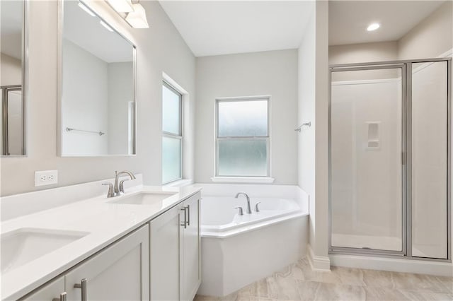 bathroom with vanity and separate shower and tub