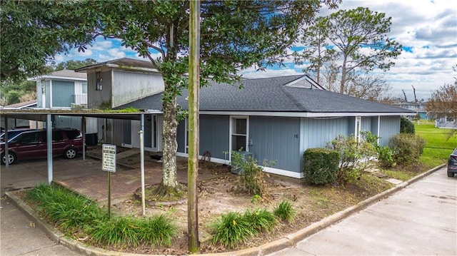 view of front of home featuring a carport