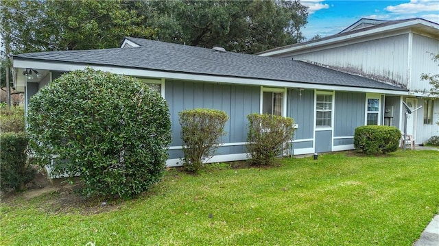 view of property exterior with a yard