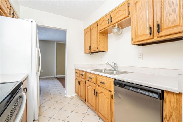 kitchen featuring sink, stainless steel appliances, and light tile patterned floors