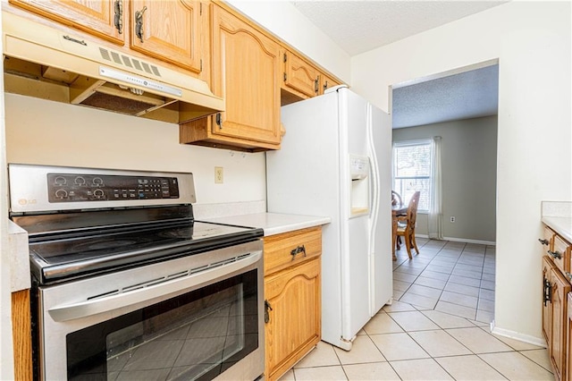 kitchen with electric stove, light tile patterned floors, and white fridge with ice dispenser