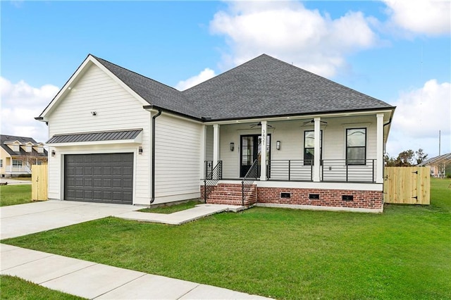 view of front of home with a porch, a front lawn, and a garage