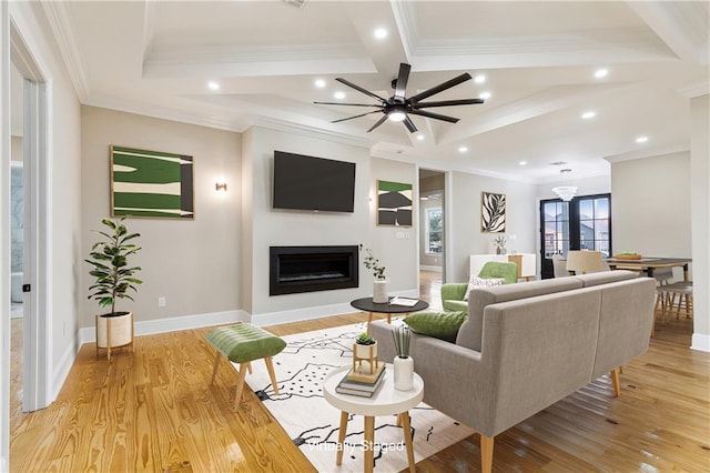 living room with ornamental molding, ceiling fan, light hardwood / wood-style floors, and coffered ceiling