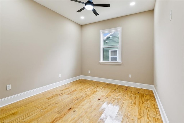 empty room featuring ceiling fan and hardwood / wood-style floors