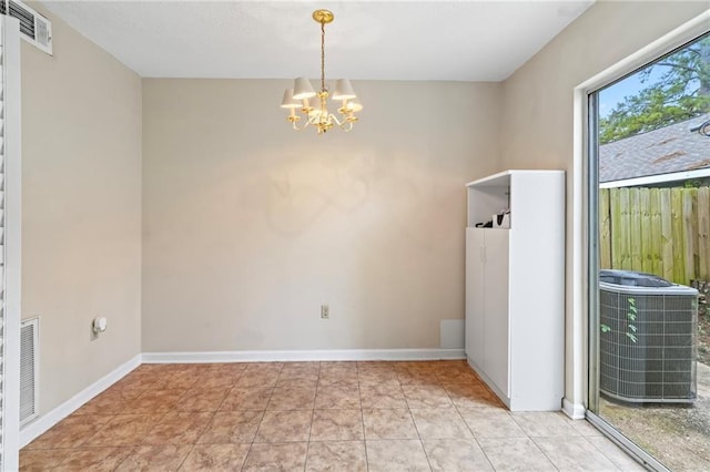 unfurnished room featuring light tile patterned flooring and a notable chandelier