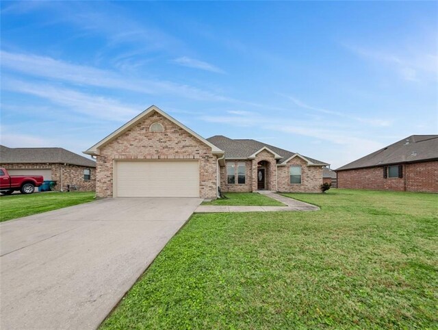 ranch-style house with a front lawn and a garage