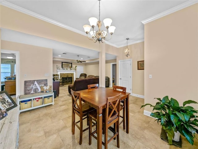 dining area with ceiling fan with notable chandelier and crown molding