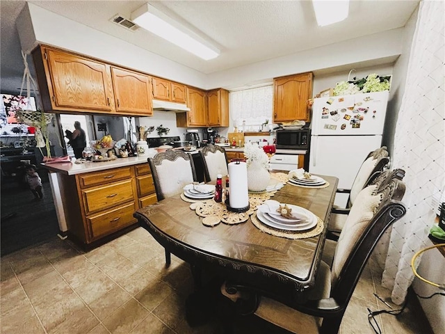 kitchen featuring white refrigerator