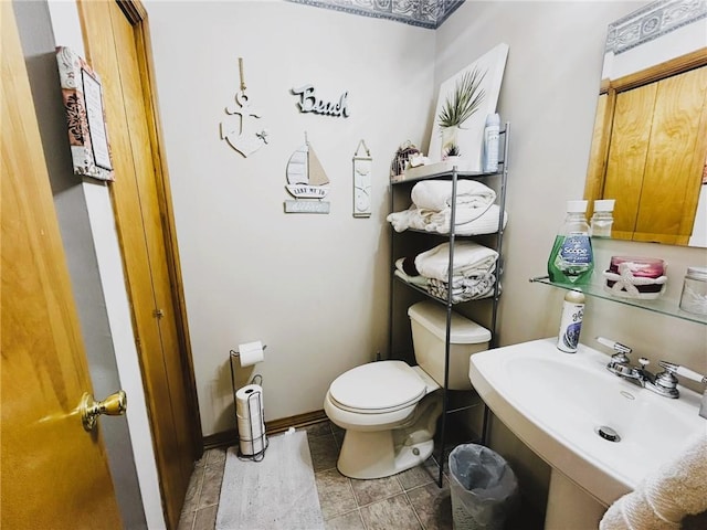 bathroom featuring sink and toilet