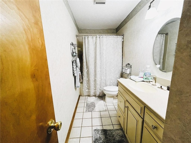 bathroom with a textured ceiling, tile patterned flooring, vanity, and toilet