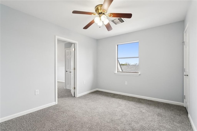 carpeted empty room with ceiling fan