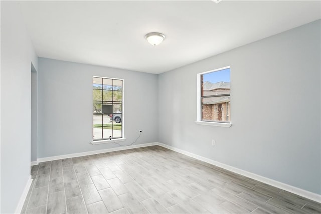 spare room featuring light hardwood / wood-style flooring