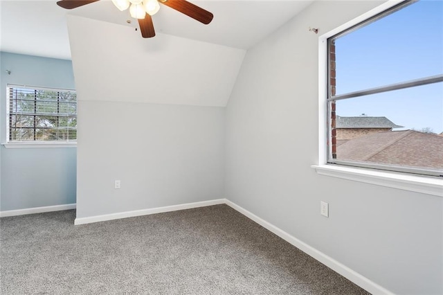 additional living space featuring carpet floors, ceiling fan, and vaulted ceiling