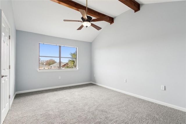 carpeted spare room featuring ceiling fan and vaulted ceiling with beams