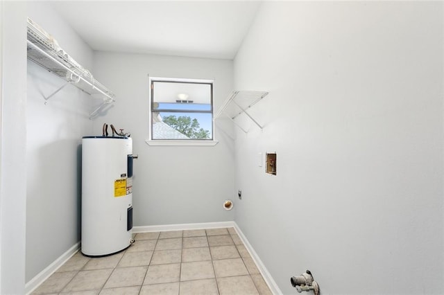 clothes washing area with water heater, light tile patterned floors, and washer hookup