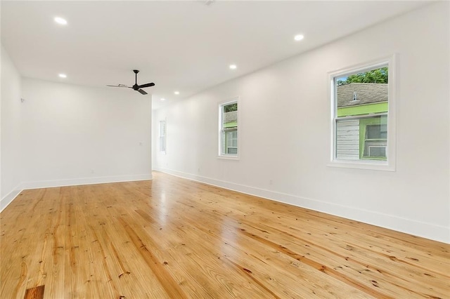 unfurnished room featuring ceiling fan and light wood-type flooring