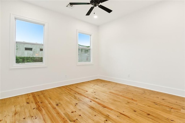 unfurnished room featuring ceiling fan and wood-type flooring