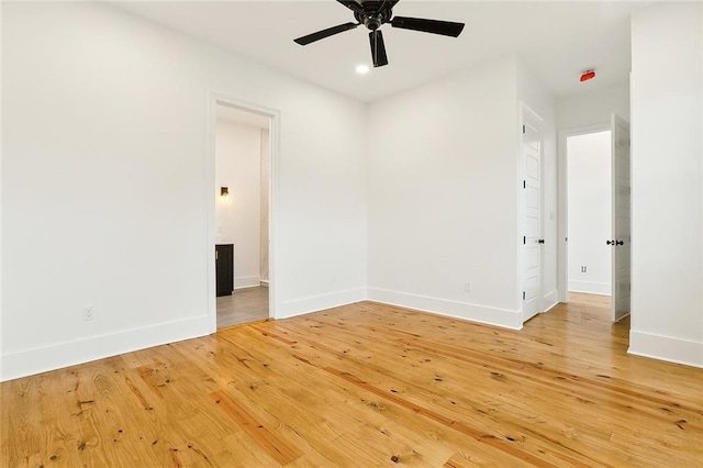 empty room featuring hardwood / wood-style flooring and ceiling fan