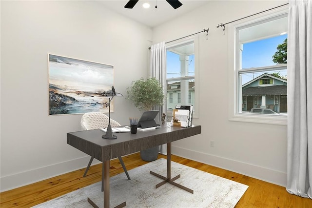 office space with ceiling fan and hardwood / wood-style floors