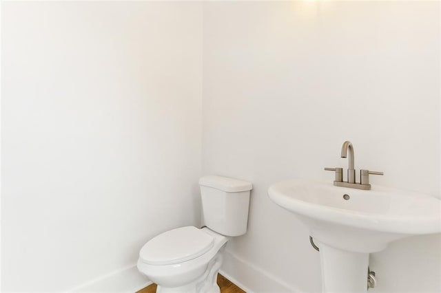 bathroom with toilet and sink